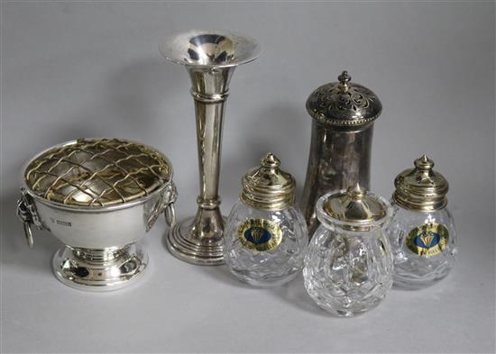 A Victorian silver pepper, a later small rose bowl, a specimen vase and a set of three silver mounted crystal condiments